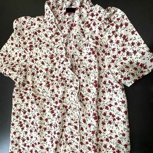 Red and white floral blouse